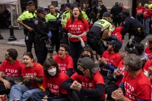 Protesters stage sit-in outside New York Stock Exchange to spotlight Gaza attacks