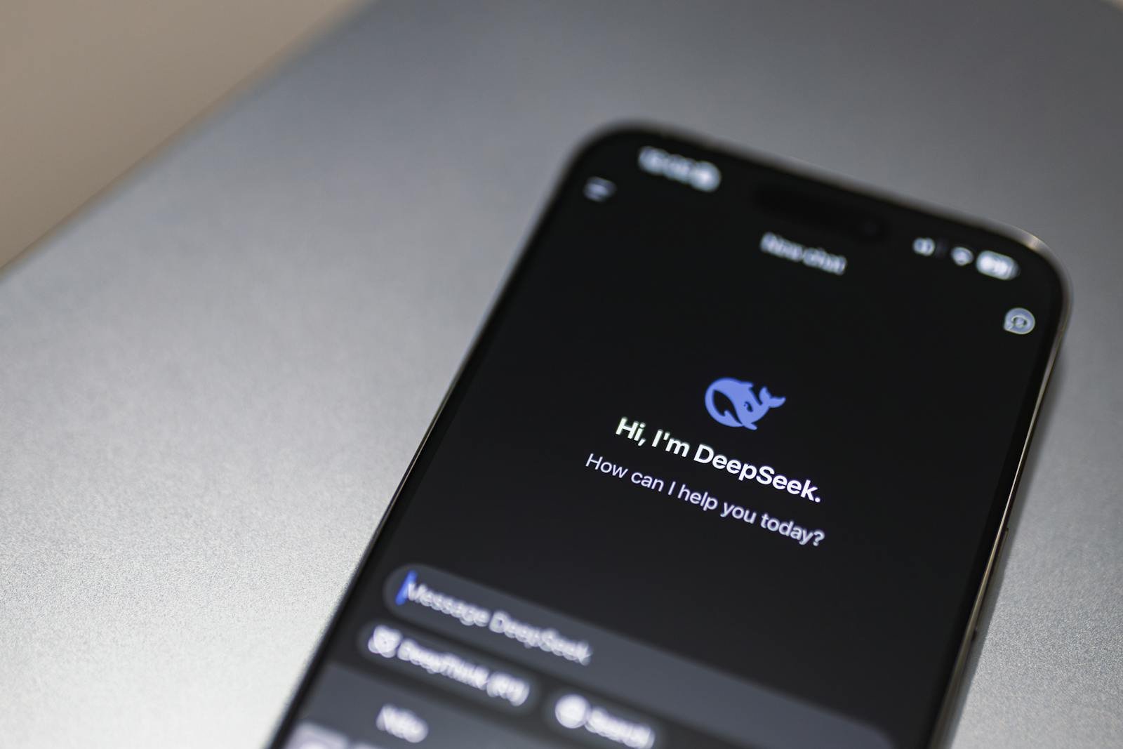 Close-up of smartphone screen showing DeepSeek AI chatbot interface on a modern device.